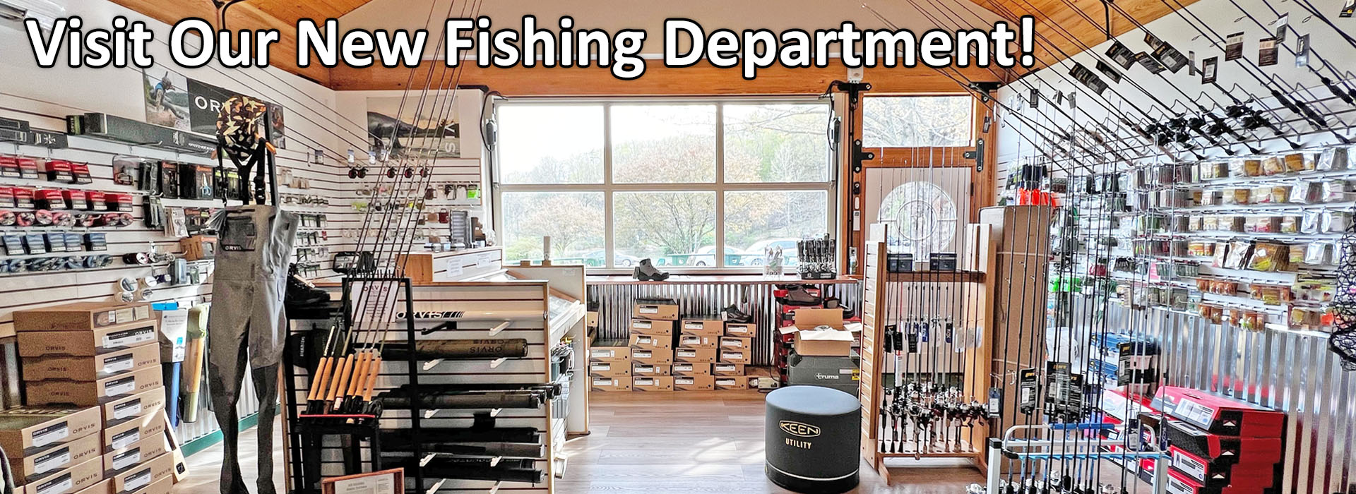 Visit Our New Fishing Department. Image of Kenco's fishing department. Image shows fly fishing rods, spin cast fishing rods, wading boots, chest waders, and various fishing tackle displayed on the walls